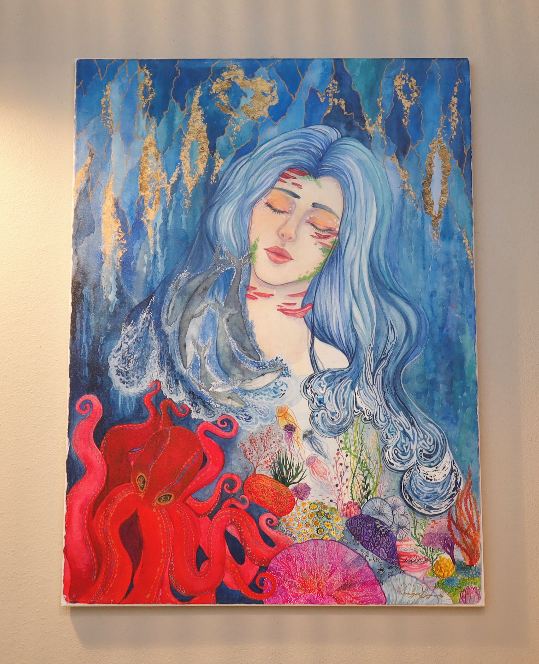 A painting with a woman, an octopus, and various flowers.