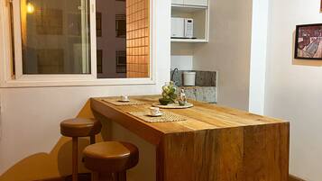 Comfort Apartment | Private kitchen | Full-sized fridge, microwave, stovetop, blender
