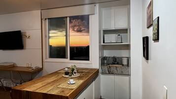 Comfort Apartment | Private kitchen | Full-sized fridge, microwave, stovetop, blender