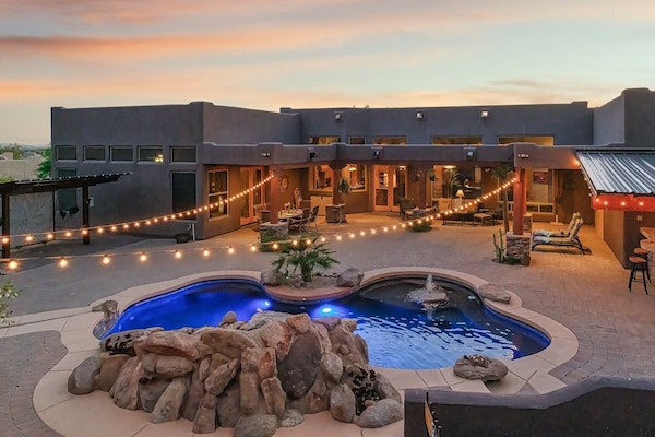 Imagine enjoying the outdoor heated shower, dining area, or plush seating.