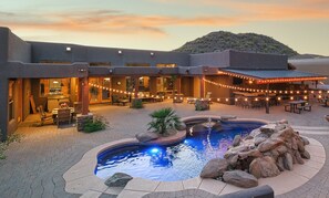 A resort with a swimming pool, outdoor seating, and string lights. - Luxury Desert Escape~ Mountain Views~ Private Pool~ King Beds (Mesa)