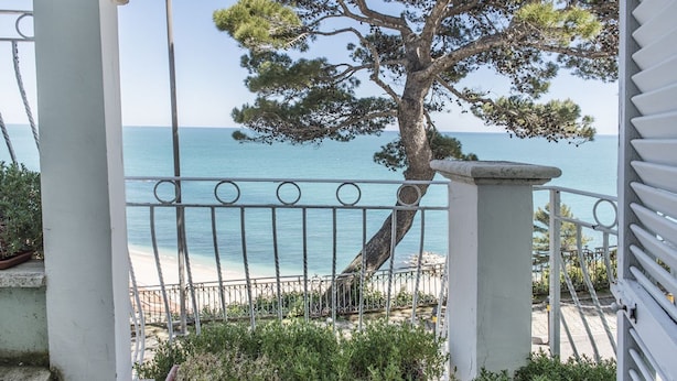 A balcony with a view of the sea, a railing, and a potted plant. - Home on the sea - Numana, prestigious sky-land with sea view (Numana)