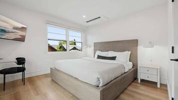 Premium bedding, laptop workspace, blackout drapes, iron/ironing board