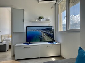 2 habitaciones, tabla de planchar con plancha y cuna de viaje 