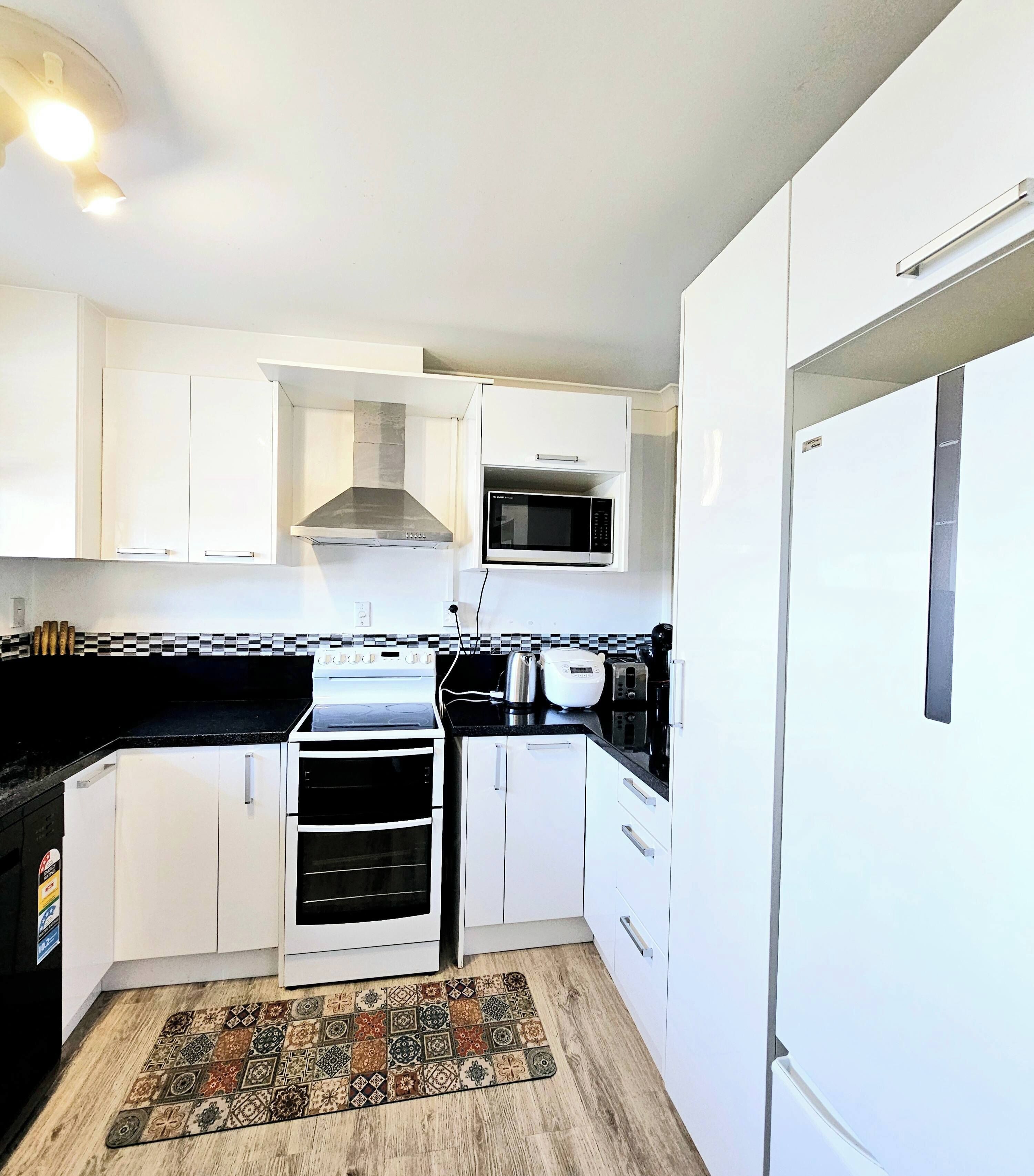 Coffee/tea maker, fridge, microwave, oven