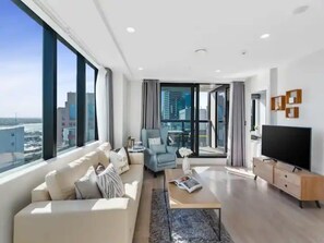 TV, offices - Sky Tower Views | 2 Bed 2 Bath CBD | Zodiak Stays (Auckland)