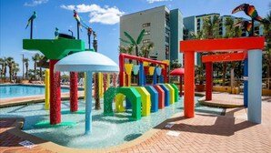 A water play area with colorful structures and a pool. - Oceanfront | Amazing Views & Sunrises (Myrtle Beach)