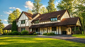 Tudor-style details and mature trees give this home a distinct, storybook feel from the moment you pull up.
