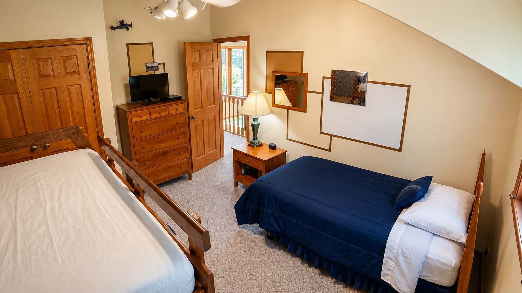 Fifth sleeper tucks into this bedroom thanks to the twin paired with a full, so the kid crew claims this room while adults take quieter beds down the hall.
