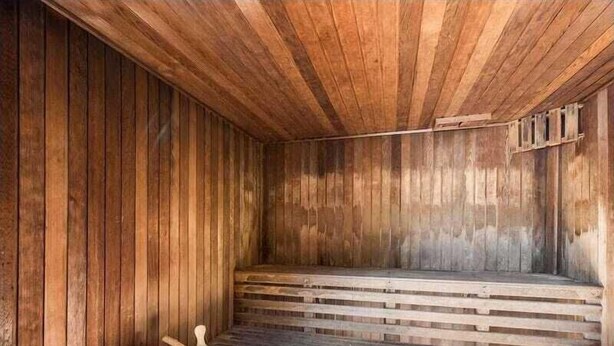 A wooden sauna with benches and a stone floor. - Nearby Showgrounds and James St and King Williams Precints (Fortitude Valley)