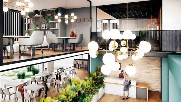 Un interior moderno con comedor, mostrador de recepción y zona de estar con plantas.