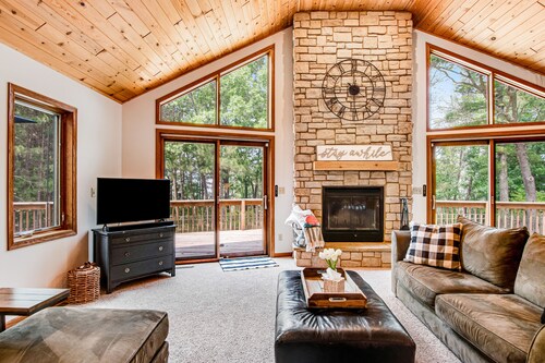 Secluded lake retreat with game room; near beach, boat rental, dining, and golf