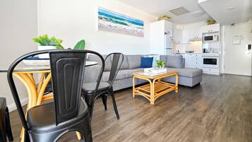 Indoor dining, with lounge and kitchen beyond