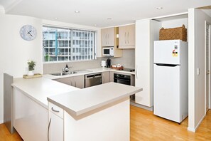 Fridge, microwave, oven, stovetop - Stylish 2 B/R Kings Beach Apartment (6 guests) ZF4 (Sunshine Coast)