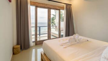 Suite Deluxe | 1 habitación y ropa de cama