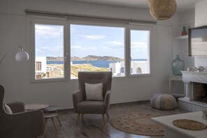 Deluxe Apartment, 3 Bedrooms, Hot Tub, Partial Sea View (Seasonal Hot tub opened May-October) | Living room | 32-inch Smart TV with cable channels, TV