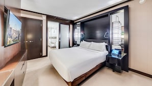 A modern hotel room with a large bed, a TV, a bedside table, and a wardrobe. - Vdara Studio by Jet Luxury (Las Vegas)