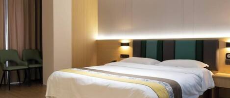 A hotel room with a bed, two bedside tables, a chair, and a curtain.