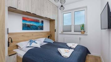1 dormitorio, tabla de planchar con plancha, wifi y ropa de cama