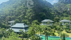 A resort with multiple buildings, a swimming pool, and lush greenery. - Minawa Kenhga Resort & Spa Ninh Binh (Gia Vien)