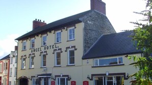 A two-story building with the sign "Angel Hotel" on the facade. - Rooms at The Angel (Cardigan)