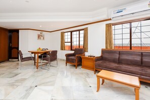 Royal Quadruple Room | Living area | 46-inch LCD TV with satellite channels, TV - Hotel Galaxy (Surat)