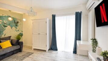 Exclusive Apartment | Living area | 123-cm LED TV with digital channels, TV