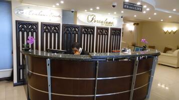 A reception desk with a sign that reads "Portalmana by Reston."