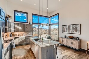Fridge, microwave, oven, stovetop - Red Fox Lodge - Mountain Modern Luxury Rental (Silverthorne)