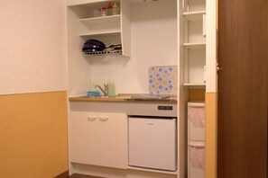 Apartment | Private kitchen | Microwave, electric kettle, dining tables - Ueno House VIP (Tokyo)