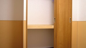 A wooden wardrobe with a shelf inside. - Ueno House VIP (Tokyo)