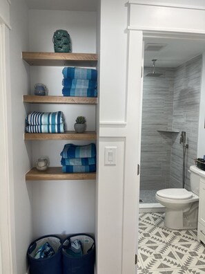 Shower, hair dryer, towels, soap