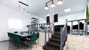 A modern kitchen with a central island, a dining area with green chairs, and a staircase with a unique design. - Yalarent Villa Viviana with private pool (Migdal)