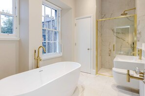 Bathtub, hair dryer, towels