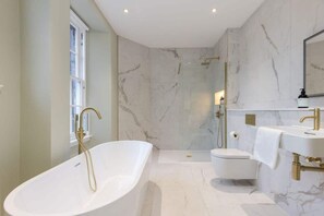 Bathtub, hair dryer, towels