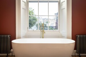 Bathtub, hair dryer, towels