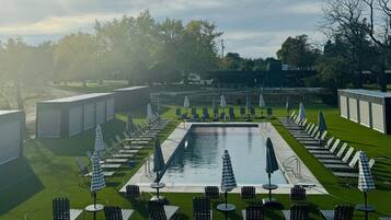Outdoor pool, open 9:00 AM to 7:00 PM, free cabanas, pool umbrellas