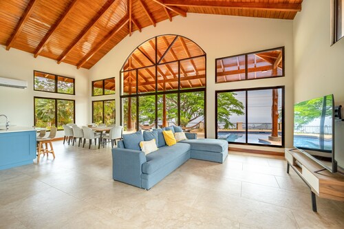 Exclusive tropical retreat with astonishing ocean views, pool, partial AC, & W/D