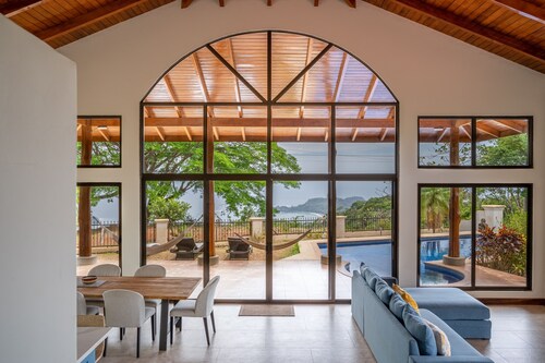 Exclusive tropical retreat with astonishing ocean views, pool, partial AC, & W/D