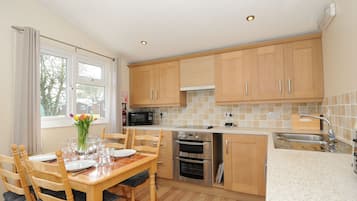 Fridge, electric kettle, cookware/dishes/utensils