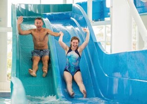 A water slide with two people sliding down. - Seton Sands, Haven!! Make Memories!! Have Fun!!!!! (PRESTONPANS)