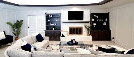 Smart TV, fireplace, books