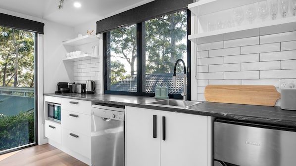 Dishwasher, coffee/tea maker, dining tables