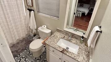 Shower, hair dryer, towels, toilet paper