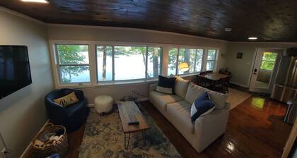 Enjoy Lake life in this renovated Camp, 50 ft from water. Private dock, beach.