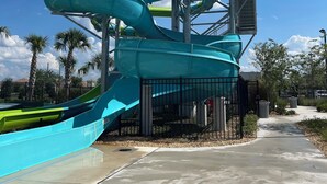 A water park with multiple water slides and a viewing platform. - Orlando resort champions gate 10 min to Disney  (Four Corners)