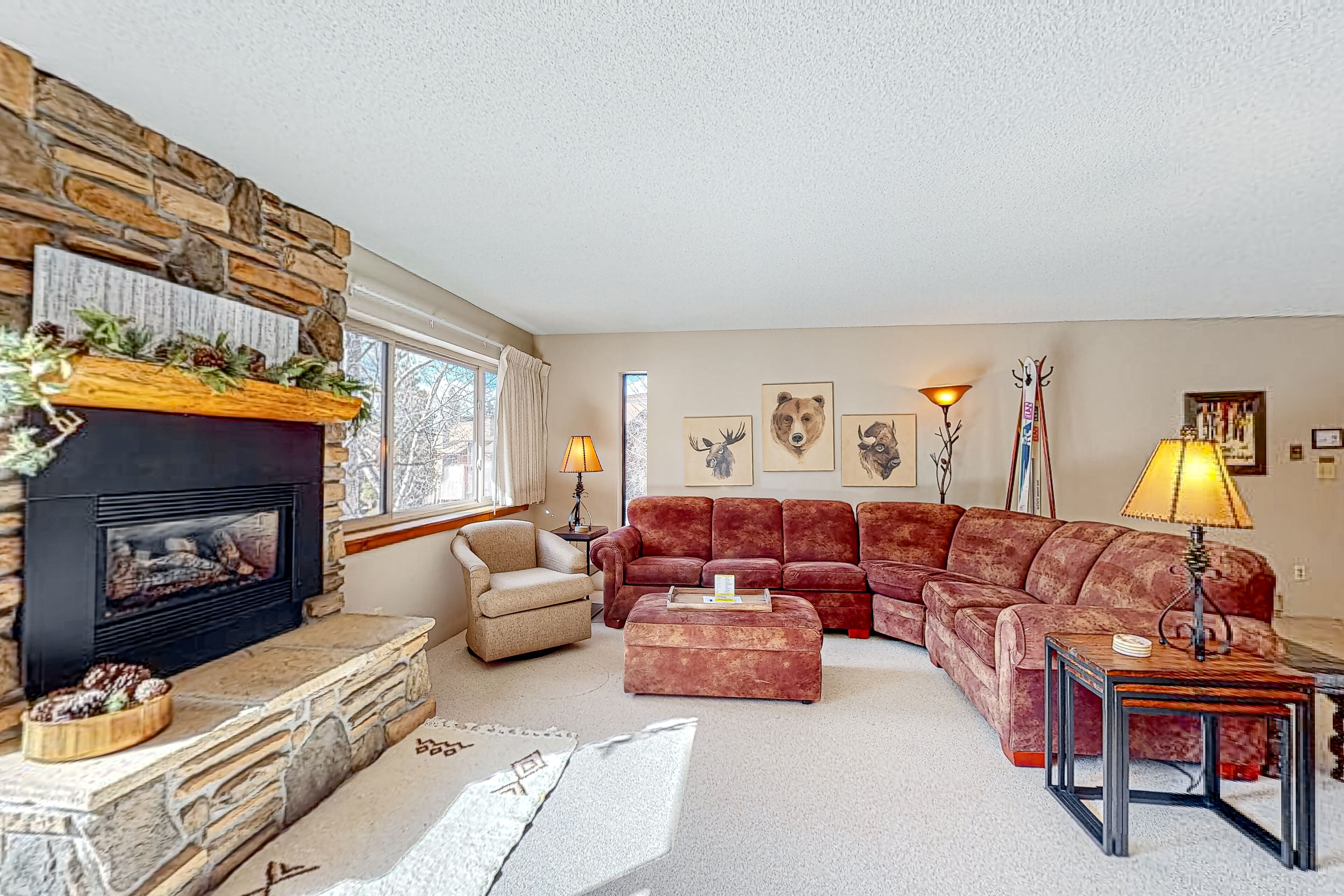 Updated ski-in condo with hot tubs, heated pool, fireplace, firepit, gym, views