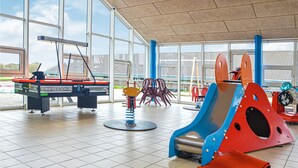 A children's play area with a table tennis table, a slide, and a climbing structure. - Nice apartment in Hemmet with sauna (Hemmet)