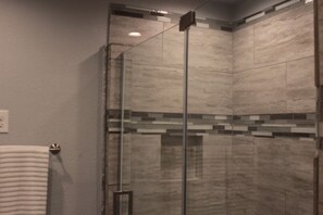 Shower, hair dryer, towels, toilet paper