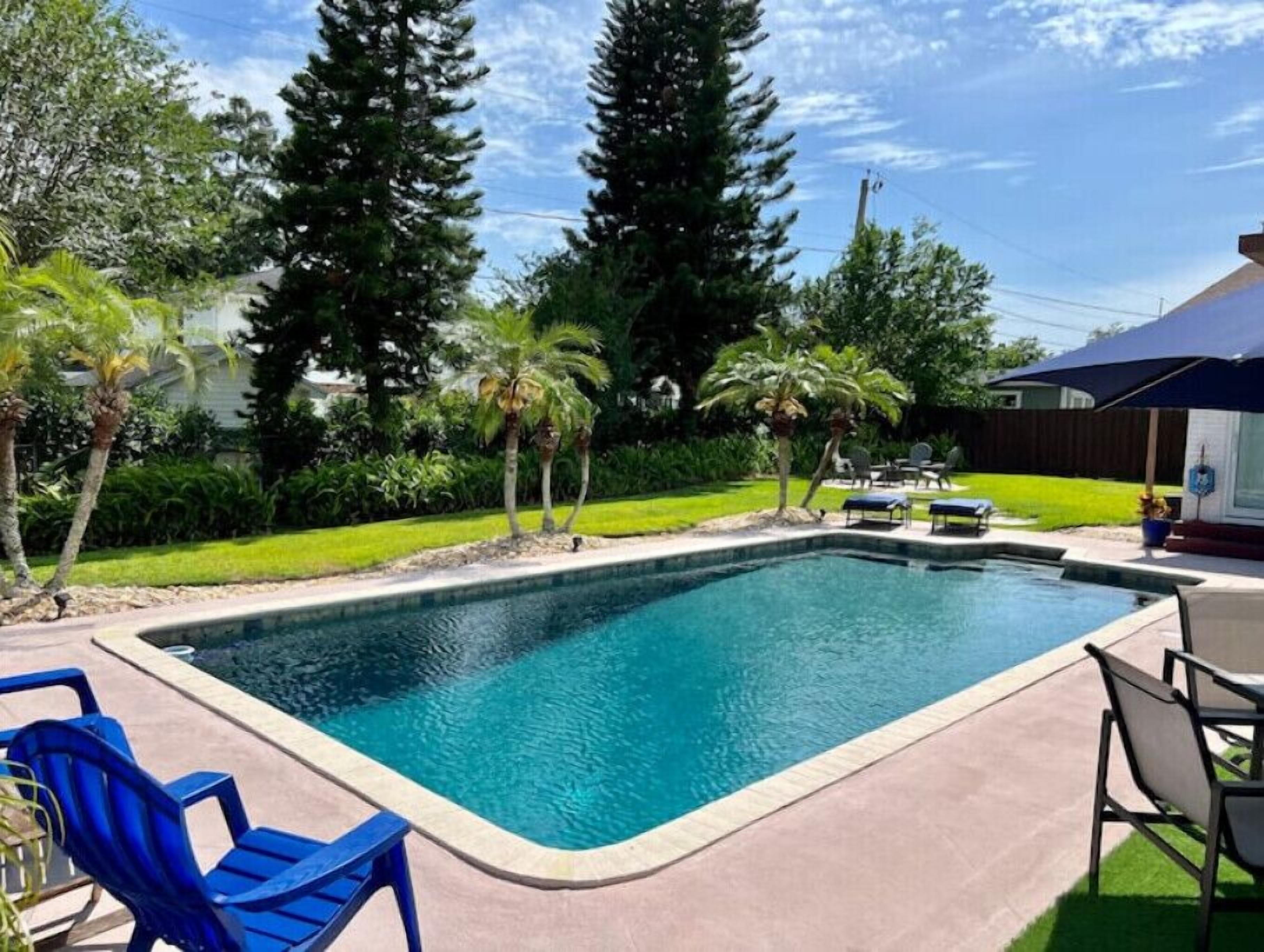 Charming home with pool, patio, and custom amenities in a peaceful neighborhood